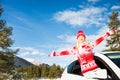 Happy woman travel by car in winter Royalty Free Stock Photo