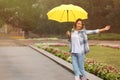 Happy young woman with umbrella under rain Royalty Free Stock Photo