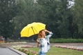 Happy young woman with umbrella under rain Royalty Free Stock Photo