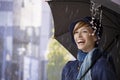 Happy young woman under umbrella in rain Royalty Free Stock Photo