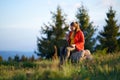 Happy young woman using laptop outdoors in summer nature, video call concept. Royalty Free Stock Photo