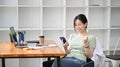 Happy woman using smartphone and celebrating success. Royalty Free Stock Photo