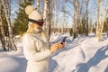 Happy young woman using smartphone makes selfie for her profile Royalty Free Stock Photo