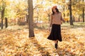 Happy young woman walking autumn park. Relaxation, enjoying, solitude with nature. Royalty Free Stock Photo