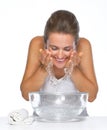 Happy young woman washing face Royalty Free Stock Photo