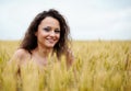 Happy young woman in wheat field Royalty Free Stock Photo