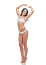 Happy young woman in white bikini swimsuit Royalty Free Stock Photo