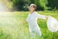 Happy Young Woman Enjoying Summer on the Green Meadow. Royalty Free Stock Photo