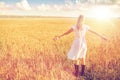 Happy young woman in white dress on cereal field Royalty Free Stock Photo