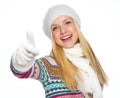 Happy young woman in winter clothes showing thumbs up Royalty Free Stock Photo