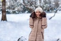 Young woman on a winter walk in winter time at nature.