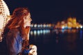 Happy young woman wondering in Budapest night panorama Royalty Free Stock Photo