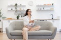 Woman working remotely from home, typing on modern wireless cell phone. Royalty Free Stock Photo