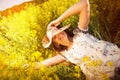 Happy young woman among yellow wildflowers Royalty Free Stock Photo