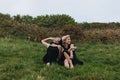 happy young women in black relaxing