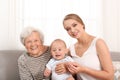 Happy young woman with her child and grandmother Royalty Free Stock Photo