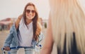 Happy young women with shopping cart