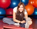 Happy young women stretching in the gym Royalty Free Stock Photo