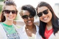 Happy young women in sunglasses outdoors Royalty Free Stock Photo