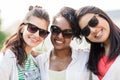 Happy young women in sunglasses outdoors Royalty Free Stock Photo