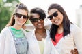 Happy young women in sunglasses outdoors Royalty Free Stock Photo