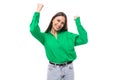 Happy young 30 year old european brunette woman model with long hair and brown eyes dressed in casual green shirt Royalty Free Stock Photo