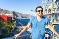 Happy Youth dude looking to the side having a good moment, with confident facial look. Smiley calm person with sunglasses enjoying Royalty Free Stock Photo