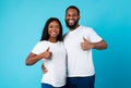 Happyafro couple gesturing thumbs up and smiling Royalty Free Stock Photo