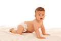 Hapy baby boy in playing on bed over white Royalty Free Stock Photo