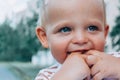 Little baby boy holding fingers in mouth. Royalty Free Stock Photo