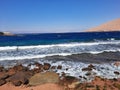 The mesmerizing view of the deep blue waters of Haql beach in Saudi Arabia. Royalty Free Stock Photo