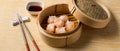 HAR GOW in bamboo steamer with sauces and chopsticks. Chinese Traditional cuisine concept. Dumplings Dim Sum in bamboo steamer Royalty Free Stock Photo