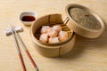 HAR GOW in bamboo steamer with sauces and chopsticks. Chinese Traditional cuisine concept. Dumplings Dim Sum in bamboo steamer Royalty Free Stock Photo