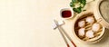 HAR GOW in bamboo steamer with sauces and chopsticks. Chinese Traditional cuisine concept. Dumplings Dim Sum in bamboo steamer Royalty Free Stock Photo