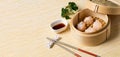 HAR GOW in bamboo steamer with sauces and chopsticks. Chinese Traditional cuisine concept. Dumplings Dim Sum in bamboo steamer Royalty Free Stock Photo