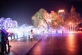 Harbin Ice Festival, people in stalin park having fun with sparklers, no faces at night