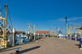 Harbor with anchored fishing boats on summer day