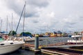 Harbor on Baltic Sea in DarÃâÃÂ³wko, Poland. Sailboats and fishing cutters floating on a water surface. Summer, cloudy, windy day. Royalty Free Stock Photo