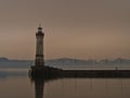 Harbor basin with famous historic Lindau lighthouse on the coast of Lake Constance, Germany.