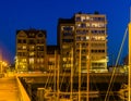 The harbor of Blankenberge with lighted buildings at night, city architecture of a popular city in Belgium Royalty Free Stock Photo