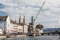 Harbor crane and GrossmÃÂ¼nster towers in ZÃÂ¼rich, Switzerland.