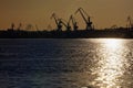 Harbor and Cranes against red sunset background Royalty Free Stock Photo