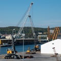 Harbor cranes and buildings at the port of Gdynia, Poland.