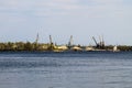 Harbor cranes at cargo port on the river Dnieper in Kremenchug