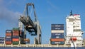Harbor cranes unloading shipping containers from a vessel in the Port of Rotterdam, The Netherlands, September 8, 2013