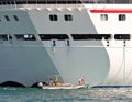 Harbor crew tending ship lines