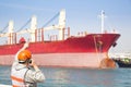 Harbor dock worker talking on radio