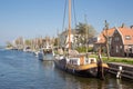 Harbor Dutch city Medemblik with historical wooden sailing ship Royalty Free Stock Photo