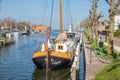 Harbor Dutch city Medemblik with historical wooden sailing ship Royalty Free Stock Photo