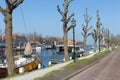 Harbor Dutch city Medemblik with historical wooden sailing ship Royalty Free Stock Photo